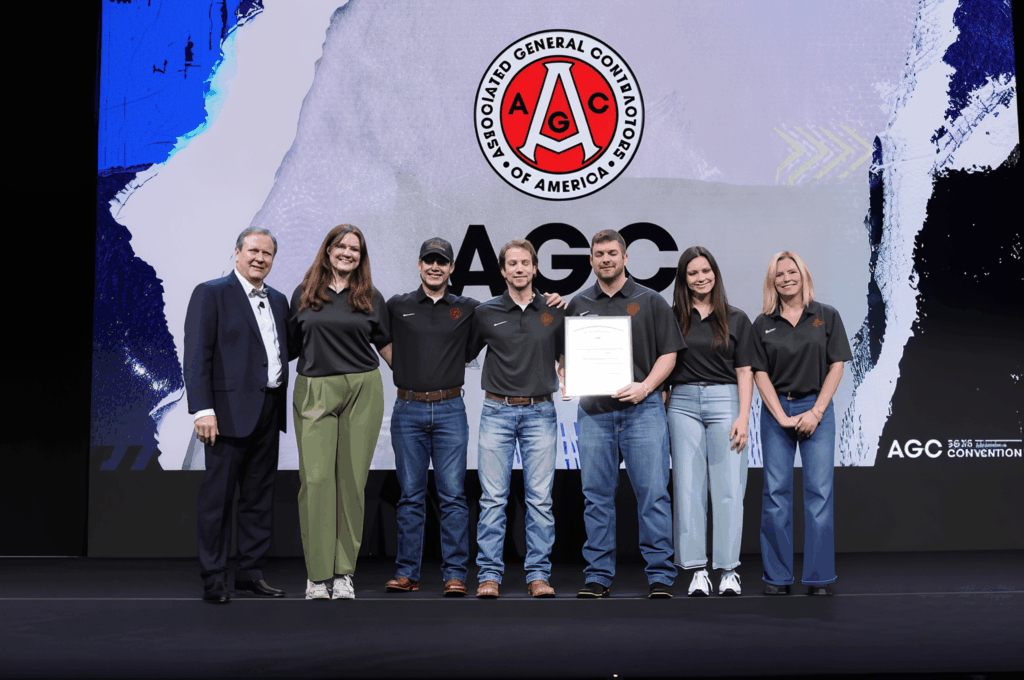 Students standing on stage at AGC of America's Annual Convention Accepting an Award